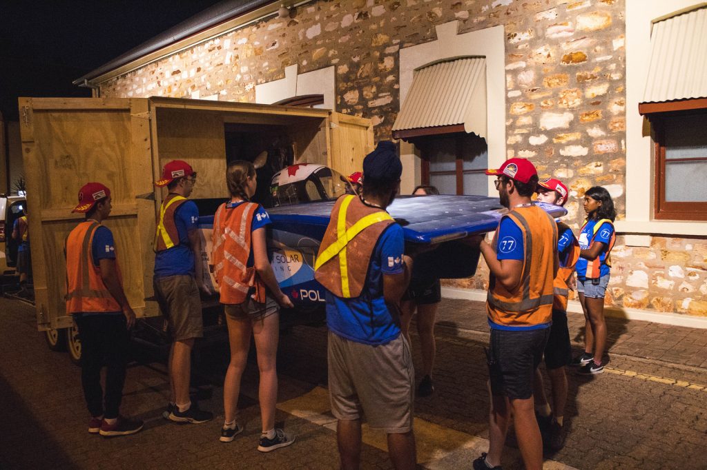 University of Toronto students unloading the solar-powered car for it's next race.