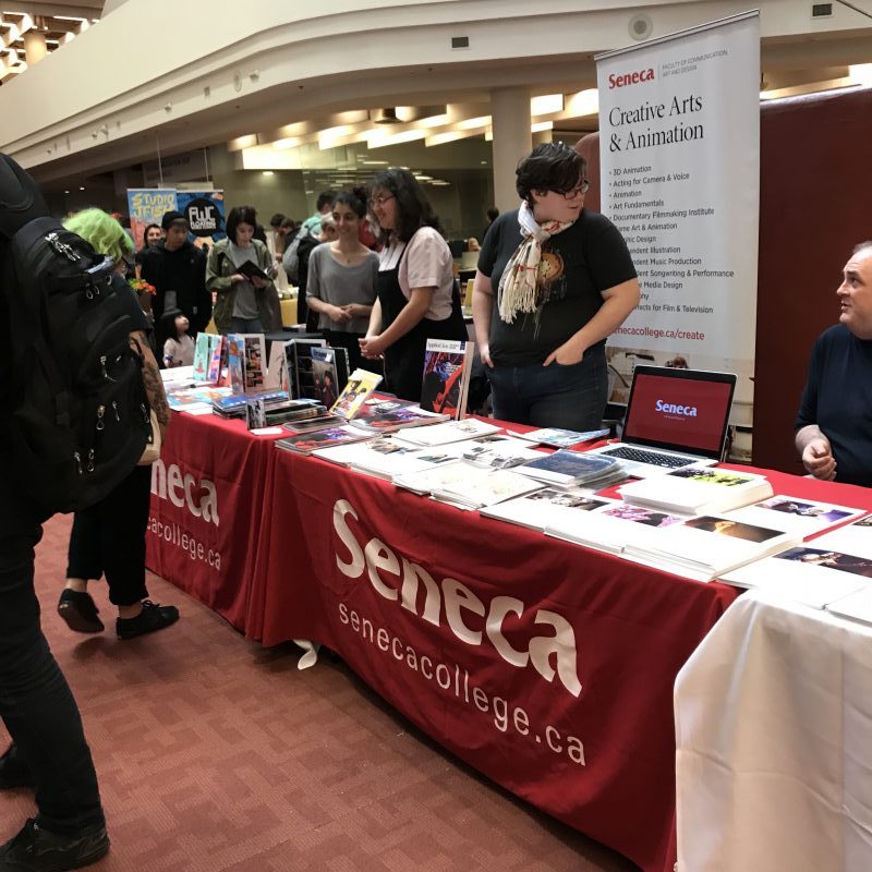 Seneca College had a printed table cloth at their trade show booth located at the entrance of TCAF