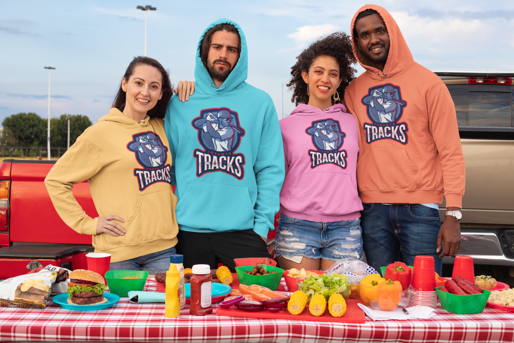 Group of friends wearing Toronto Track and Field Sweaters